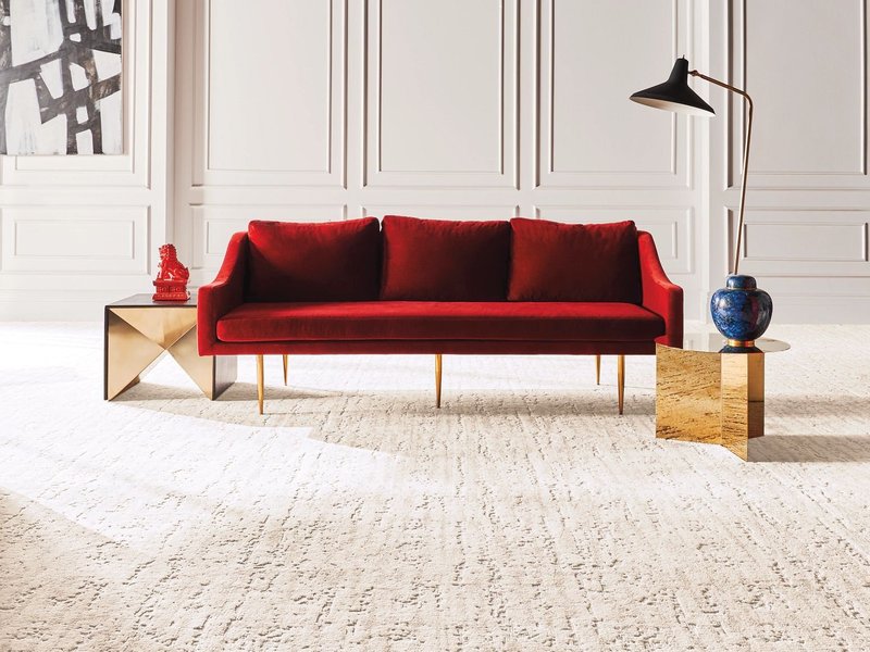 red sofa on carpet on Winter Park, FL area by Deloreto Flooring Inc